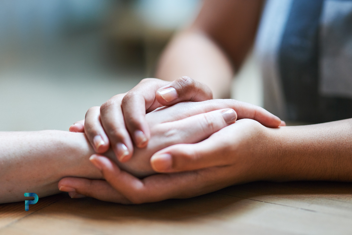 a pair of hands holding another pair of hands