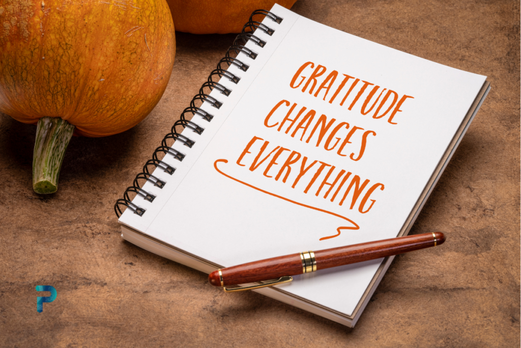 pen and journal with title of gratitude changes everything