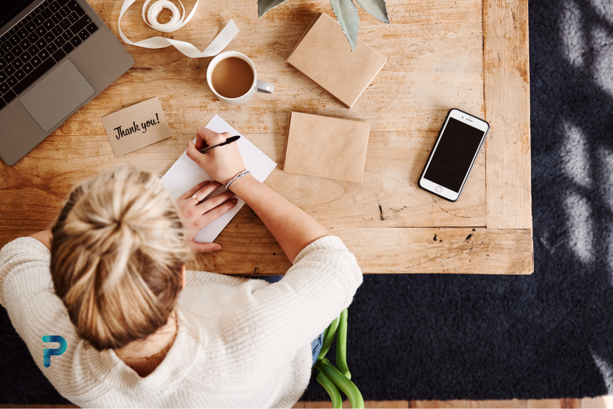 lady writing sitting at desk