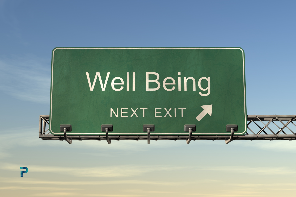 road sign telling well being is ahead